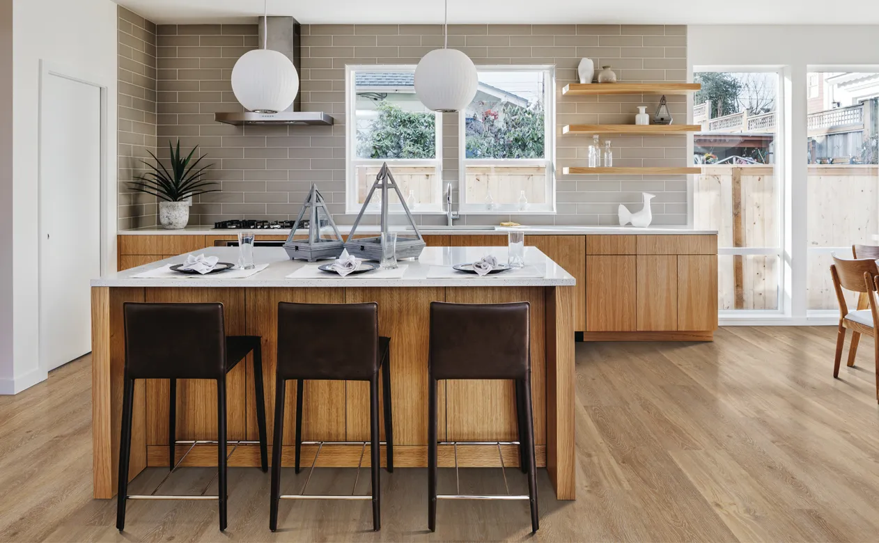 medium toned flooring in open kitchen